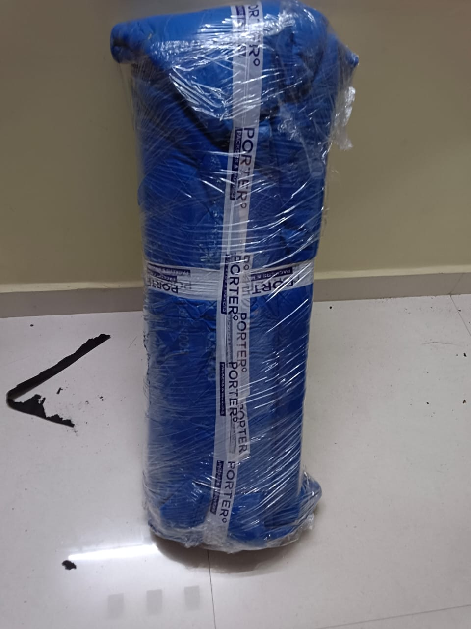 Mattress rolled and packed for transport